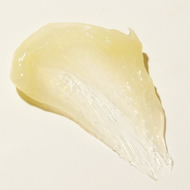 Texture photo of cleansing balm for sensitive that is thick, translucent light yellow colour and very shiny 